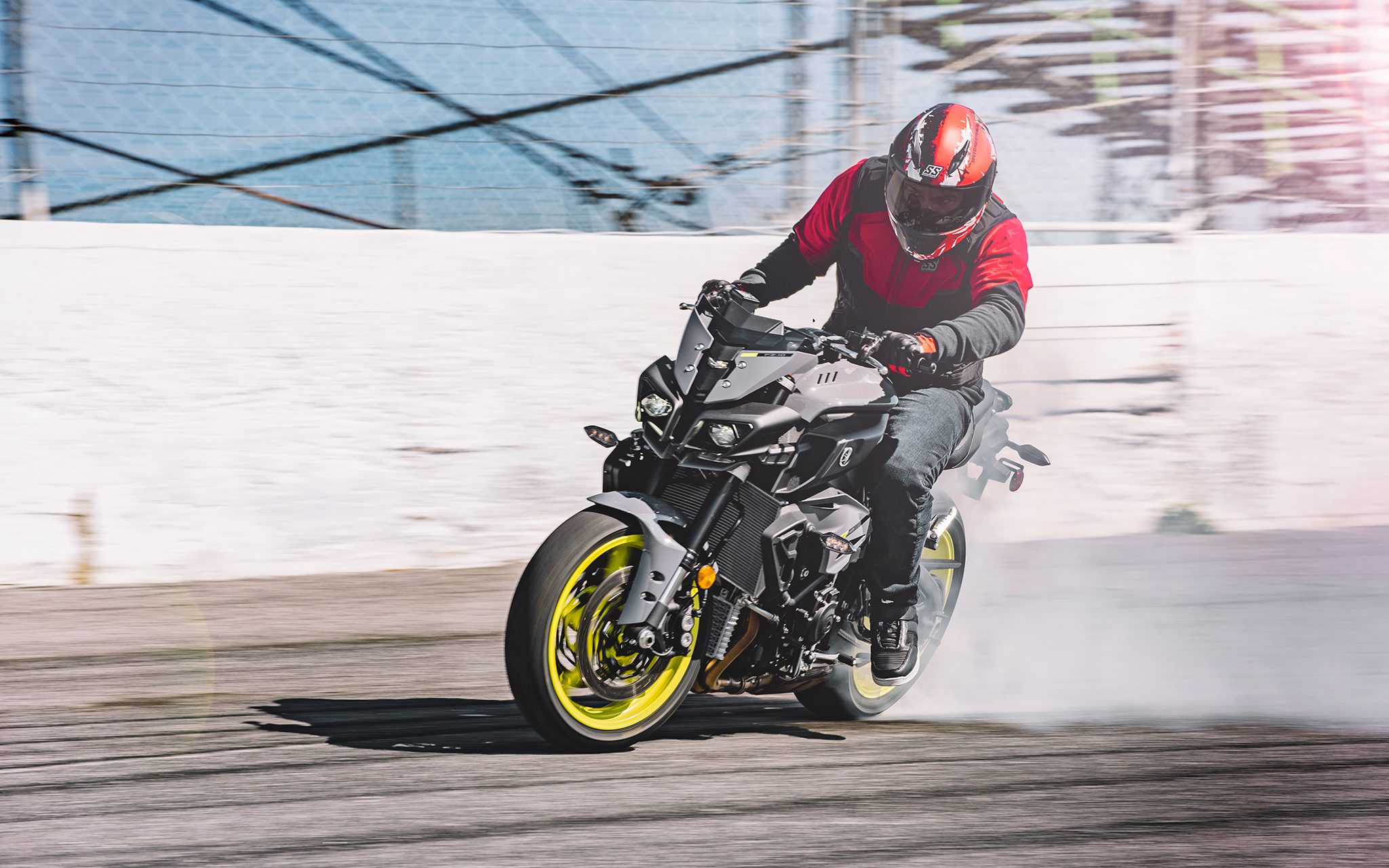 Rider wearing red Speed and Strength SS1600 Critical Mass Helmet and doing burnout