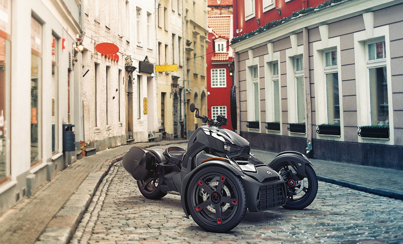 black Can Am Ryker parked on cobblestone street
