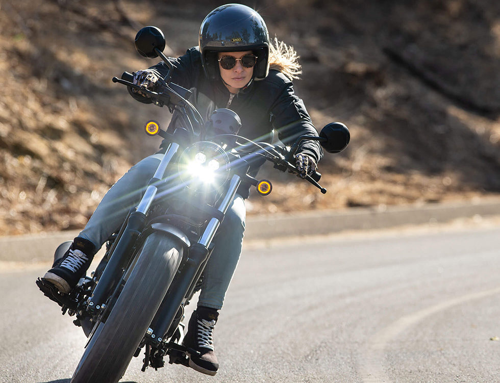 Person test riding a 3-wheel motorcycle