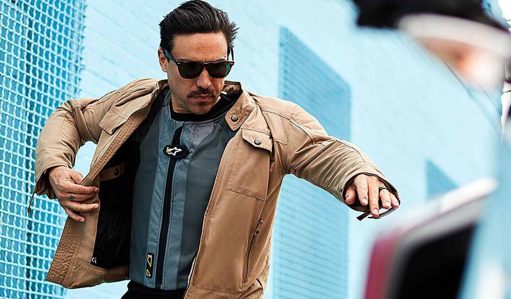 Rider pulling jacket over Alpinestars Tech-Air 5 Airbag Vest