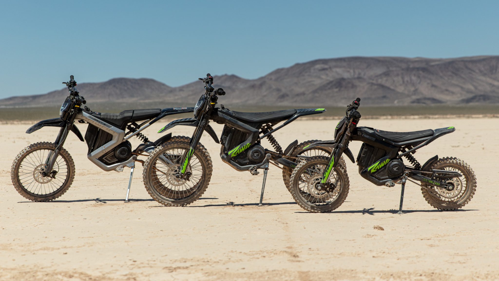 line-up of 3 Mantis e-moto models parked in desert