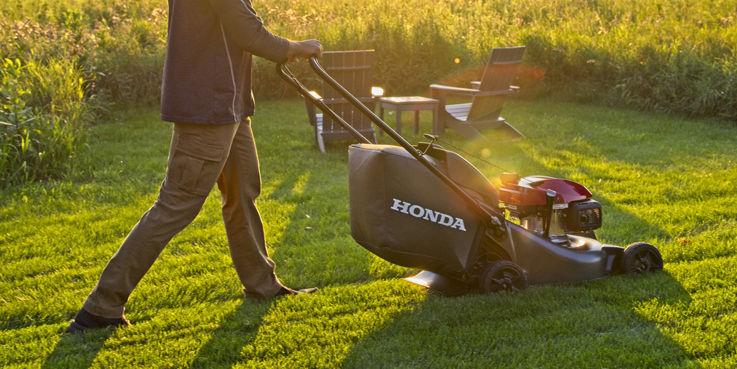 Lifestyle of man mowing lawn